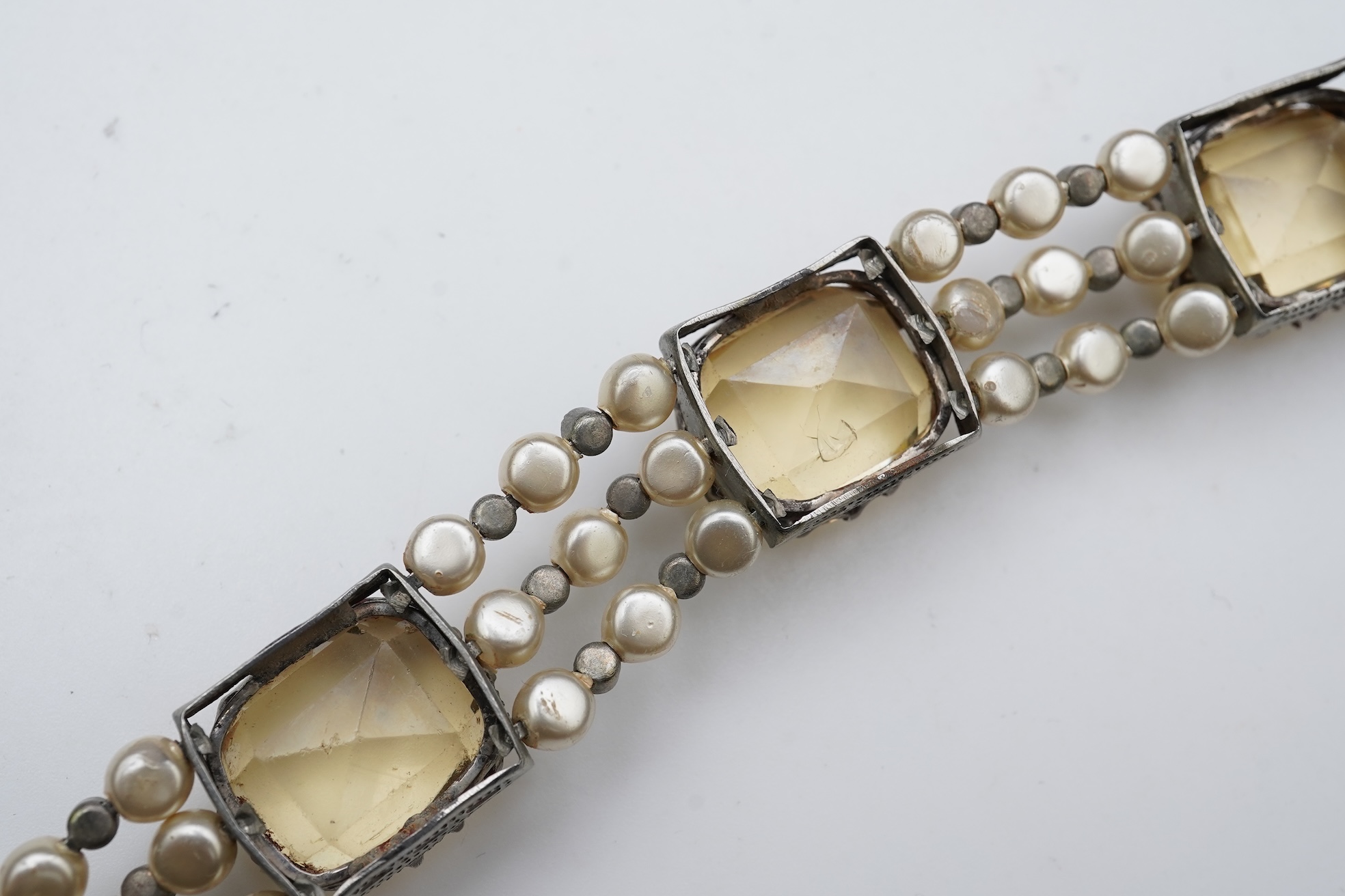 A collection of citrine jewels and a paste bracelet